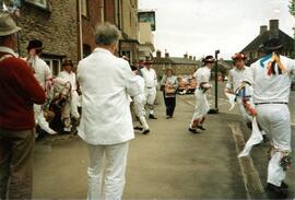 Reg Hall playing the fiddle for squire Francis Shergold's team The Bampton Traditional Morris Men...