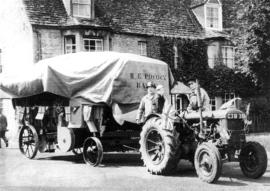 Harry Pocock with his thrashing machine and tractor in 1958