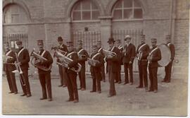 Bampton Brass Band, early 20th century. Market Square. Notice that the arches of the Town Hall we...