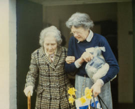 Mrs Ada Tanner being helped by Mrs Irene Sharp. 1986
