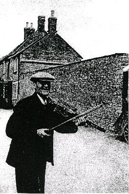 William Nathan 'Jingy' Wells with his first, homemade fiddle