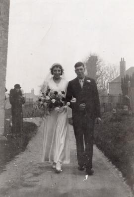 Son Townsend escorting his sister Gladys to her wedding at Bampton church