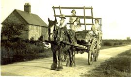 A family and hay cart by Meadow Farm Cottages, Buckland road.