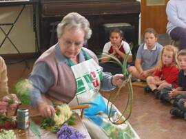 Vera Elward showing flower garlands