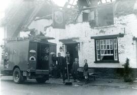 Firemen clearing Elephant & Castle after the fire in 1958 with Son and Cyril Weeks, boys from...