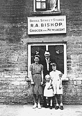 Evacuee family outside Emmie & Edie's mother's shop WWII