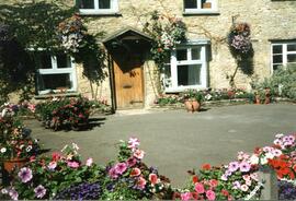 Cromwell House surrounded with flowers at the front