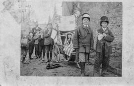 Children dressed up with banners and flags