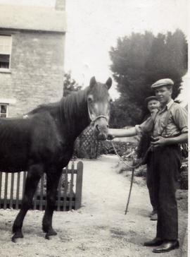 Son Townsend behind Thomas Portlock, Mary Elizabeth Townsend's father, with horse Peggy