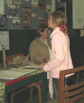 Looking at WW1 exhibition in Bampton Museum, in the Vesey room, Februray 2004.